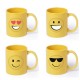 Divertida taza de color amarillo con emoji dibujados; con gafas de sol, sonrisa, guiño y ojos de corazón.
